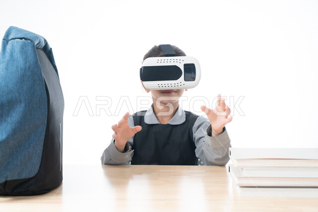 Adopting new learning methods, using virtual reality glasses in education, a portrait of an Arab Gulf Emirati student wearing a school apron indicating that she is holding something and interacting with the educational virtual world, a Saudi student sitti