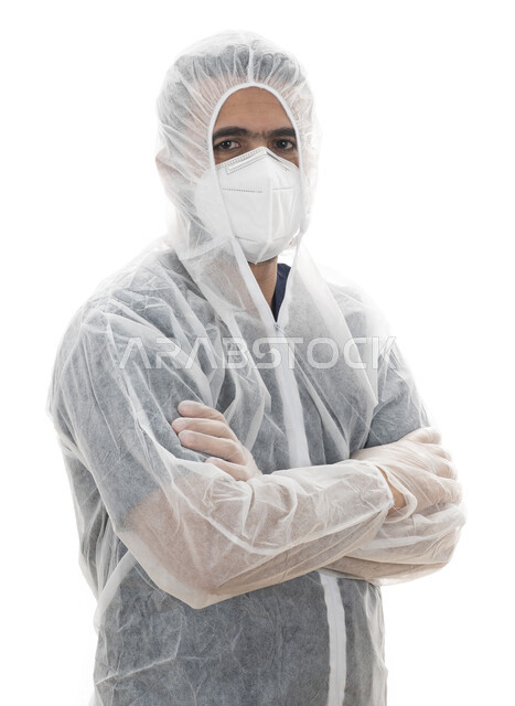 ايماءات أيدي متقاطعة ,بورتريه مقرب لطبيب سعودي يرتدي اللباس الأبيض العازل الواقي لمكافحة فايروس كورونا, شاب عربي اماراتي خليجي يقوم بإتباع توصيات وزارة الصحة في الحفاظ على السلامة, الالتزام بالاحترازات والإجراءات الوقائيه ضد كوفيد 19