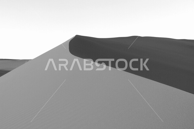 Black and white image of sand dunes in desert areas, sand formations, golden sands in the desert, desert terrain, desert areas, beauty of desert nature