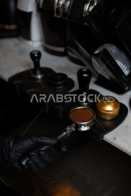 Close-up of a man preparing coffee, coffee machine, using the lever of the espresso machine, preparing an espresso cup, making delicious coffee, hot drinks