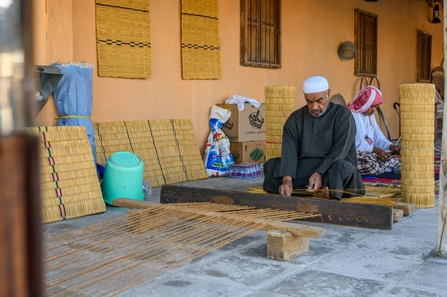 Qatari Craftsman Weaving Fishing Net in Doha - Photo