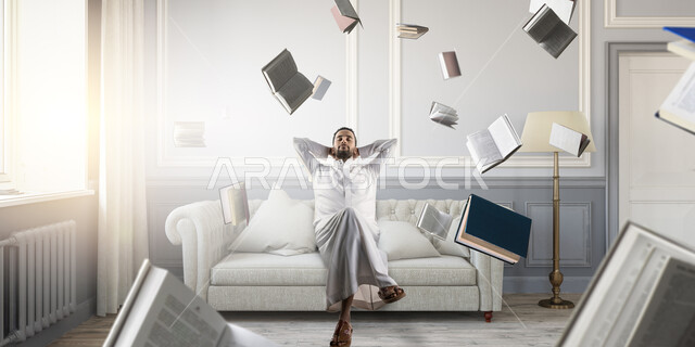 Portrait of a Saudi Arabian Gulf man lying on a white sofa, the need for rest, feeling tired, sleeping and relaxing, feeling exhausted, laziness and lethargy, facial and hand gestures indicating fatigue, flying books