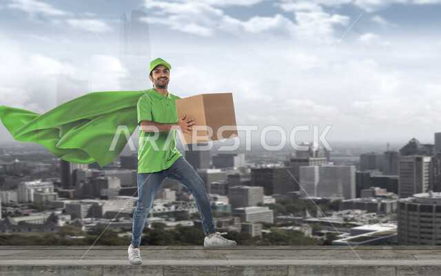 رجل عربي خليجي سعودي يرتدي رداء سوبرمان، التوصيل السريع، الابراج وناطحات السحاب، مدينة الرياض، العمل في توصيل الطلبات والبضائع للزبائن، الشحن والتوصيل، مندوب توصيل، خدمات التوصيل السريع، خلفية ابراج الرياض