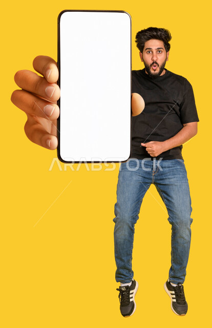 Portrait of a Saudi Arabian Gulf man, displaying a large mobile phone screen, white hollow mobile screen, jumping high, online shopping stores, techniques and technology, e-marketing, yellow background