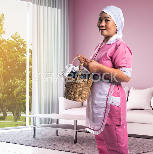 A cleaning lady carrying a basket for household cleaning tools, housekeeper, hygiene and disinfection, cleaning tools and equipment, foreign domestic maid, cleaning and home protection
