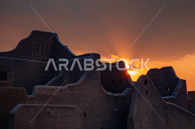 The ancient walls of Diriyah in the city of Riyadh in the Kingdom of Saudi Arabia at sunset, the historical Al-Turaif neighborhood, a cultural and tourist center, the jewel of the Kingdom, a heritage village, the ancient buildings in Diriyah, the historic