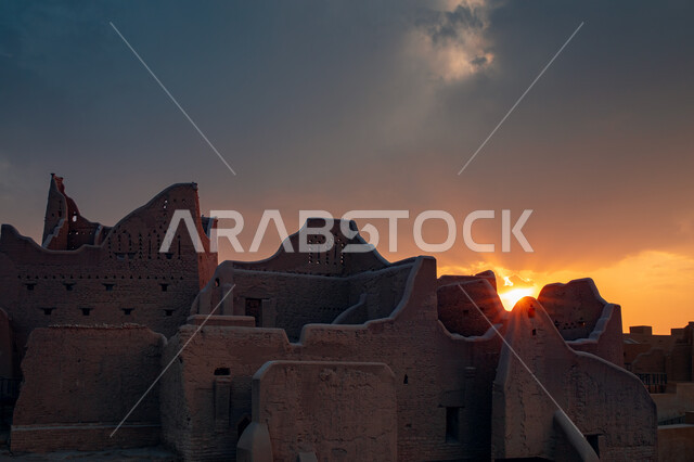 The ancient walls of Diriyah in the city of Riyadh in the Kingdom of Saudi Arabia at sunset, the historical Al-Turaif neighborhood, a cultural and tourist center, the jewel of the Kingdom, a heritage village, the ancient buildings in Diriyah, the historic