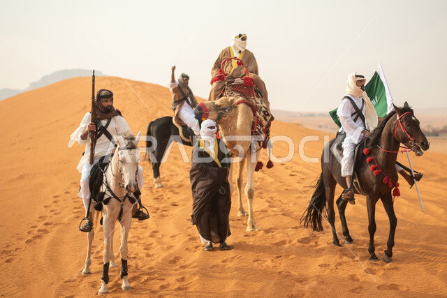 Two Saudi Arabian Gulf knights riding horses in the Saudi desert, using the Saudi rifle, raising the Saudi flag, wearing traditional folk costumes, a masked man riding a camel, commemorating the Saudi founding, the first Saudi state 1727 AD, Saudi foundin