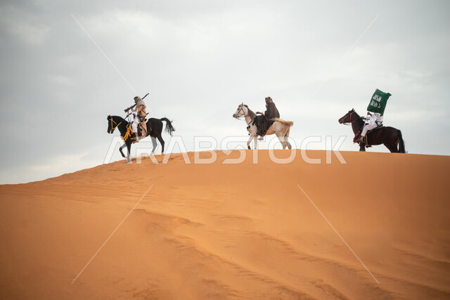 Saudi Gulf Arab knights riding horses in the Saudi desert, using the Saudi rifle, raising the Saudi flag, wearing traditional folk costumes, commemorating the Saudi founding, the first Saudi state 1727 AD, Saudi founding day, Saudi national holiday