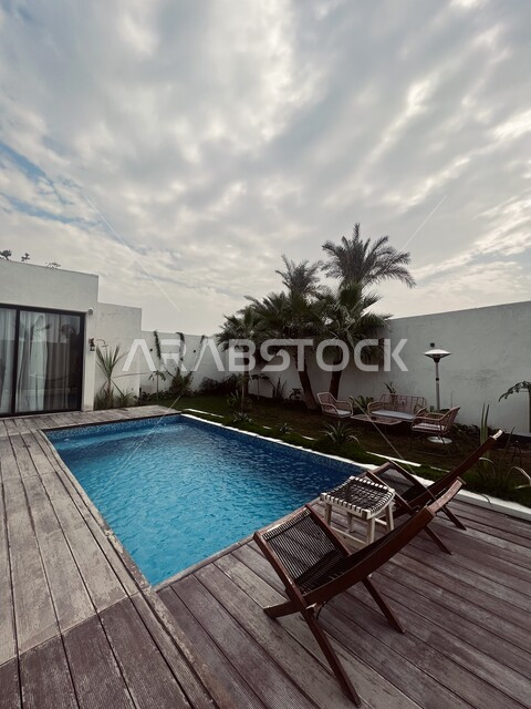 External image of a villa with a swimming pool, modern and attractive designs, wonderful decorations, architectural engineering, tourist residential apartments, luxury hotels, recreational tourist places, tourist chalets