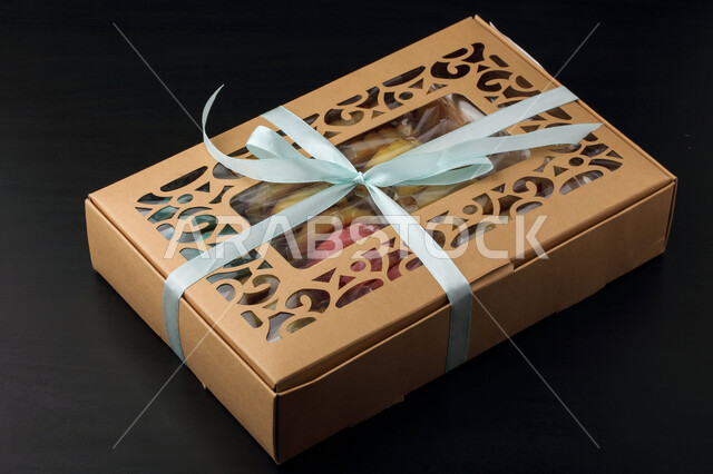 Wooden box for date maamoul, colorful square shape, fragile popular sweets, Eid cakes, gifts, hospitality