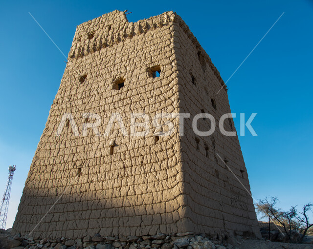 A wall of an old house made of mud in the Asir region in Ahad Rufaidah, archaeological historical places in the Kingdom of Saudi Arabia, old buildings, old historical houses.