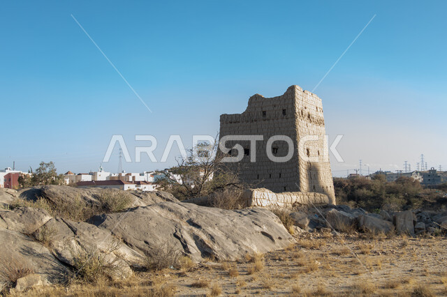 A wall of an old house made of mud in the Asir region in Ahad Rufaidah, archaeological historical places in the Kingdom of Saudi Arabia, old buildings, old historical houses.