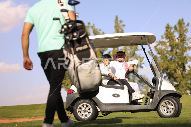 Two Saudi Arabian Gulf men with a little boy on the golf course, an electric car specialized in transporting passengers, playing golf on large green areas, sports activities in Saudi Arabia, golf, summer Olympics sports, recreational activities