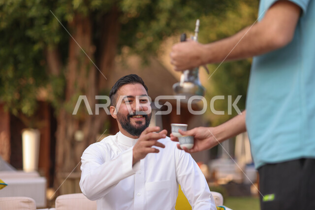 Saudi Gulf Arab youth spending fun times, youth sessions and activities, hospitality of Saudi Arabian coffee, discussions and dialogues, people and acquaintance, youth gathering, outdoor picnic, green nature