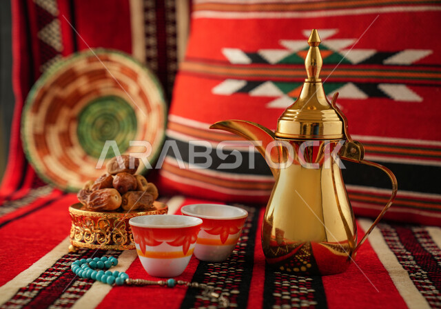 Arabic coffee dallah with two cups of coffee, dates dish, serving hot coffee, Saudi hospitality, Arabic coffee, good hospitality and reception, Ramadan, holidays and occasions