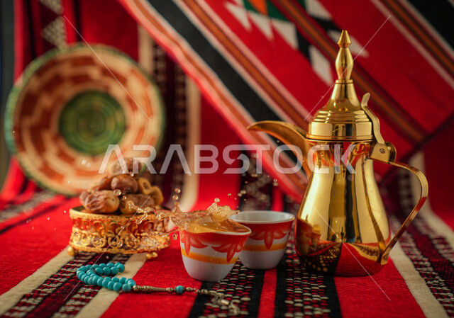 Arabic coffee dallah with two cups of coffee, dates dish, serving hot coffee, Saudi hospitality, Arabic coffee, good hospitality and reception, Ramadan, holidays and occasions