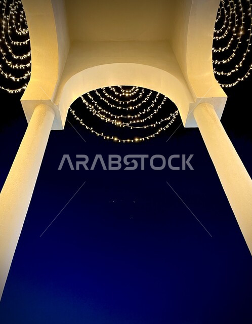 A close-up of the lights shining at night, architecture, adorning the wall of the house, decorations for celebrations