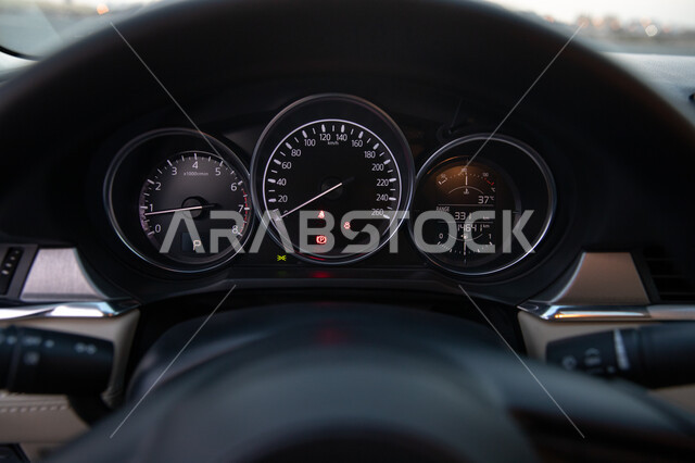 Close-up of car speedometer, Mazda car counter, round digit counter, speed gauge