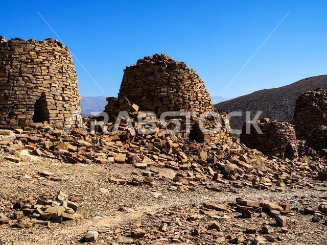Wadi Al Aya Beehive Tombs, with the Jebel Misht mountain in the ...