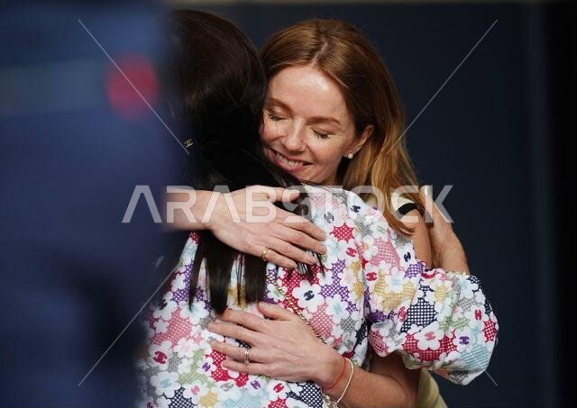 Team Hug Vector Geri Horner hugs Daranee Yoovidhya before the Bahrain Grand Prix at the ...