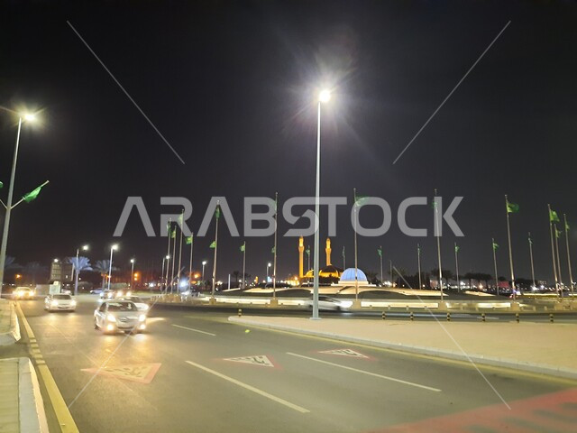 Car traffic on Jeddah Corniche Road, the waterfront in Jeddah, Saudi Arabia, and tourist attractions at night in Jeddah.