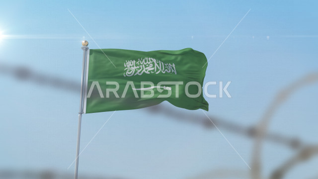 The Saudi national flag flutters high during the day in the Kingdom’s sky, Celebrating the Saudi National Day, the Kingdom’s National Day, the banner of monotheism and Islam, the Kingdom of Saudi Arabia