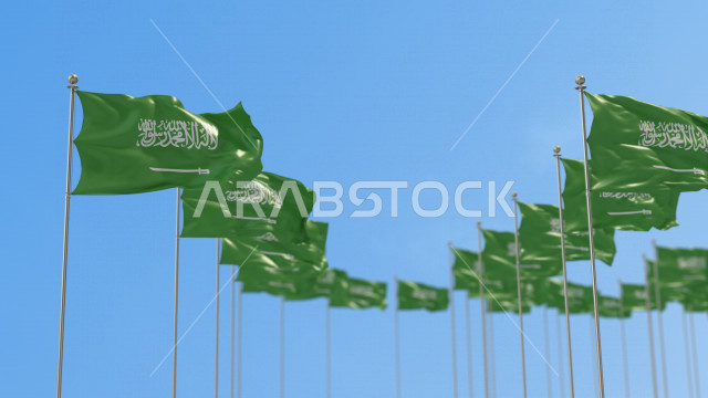 مجموعة  من أعلام السعودية في صفوف ترفرف في سماء المملكة وقت النهار ، العلم الوطني السعودي يرفرف عاليا ، الإحتفال باليوم الوطني السعودي ، العيد الوطني للمملكة ، راية التوحيد و الإسلام ، المملكة العربية السعودية