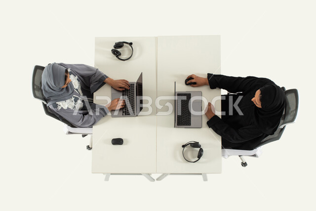 Technical support and customer service, vertical image of two Saudi ...