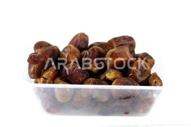 Close-up of a plate of healthy diabetes dates, a meal with a high nutritional value, Ramadan hospitality, types of healthy and delicious dates, white background
