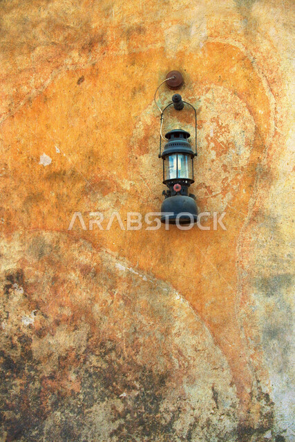 An antique wall hanging lamp, a traditional Arabic lamp, an old-fashioned lamp made of brass