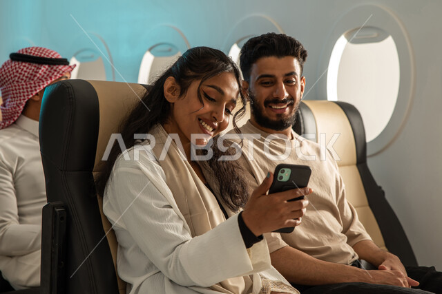 Passengers from the Saudi Gulf Arabs inside the cabin of the plane ...