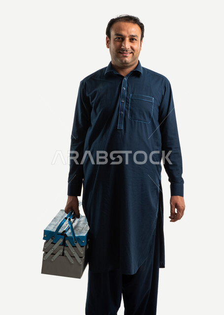 Portrait of a construction worker holding a metal toolbox in his hand, a Pakistani man in traditional Pakistani dress, an iron toolbox, recruiting labor from abroad, white background
