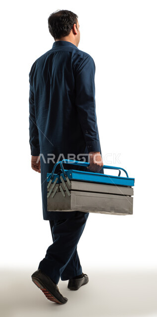 A back image of a construction worker with gestures indicating movement, walking and moving forward, a portrait of a Pakistani man wearing traditional Pakistani dress and holding a metal toolbox in his hand, bringing in labor from abroad, full length body