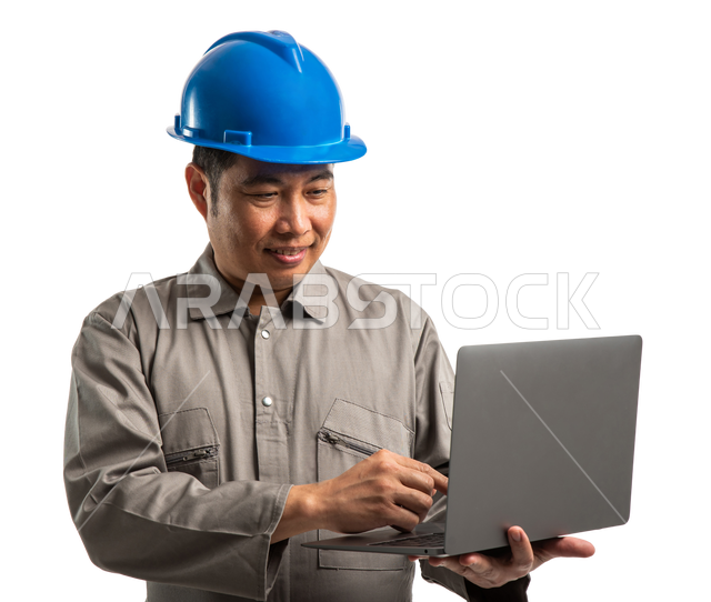 Portrait of an architect using a laptop, a Filipino construction worker ...