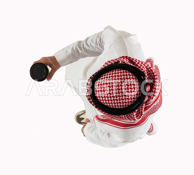 Smart electronic shopping and online orders, a vertical top image of a Saudi Arabian Gulf man carrying a cup of coffee, receipt of purchases and orders, a reliable purchase and delivery process, express delivery services for hot drinks, white background