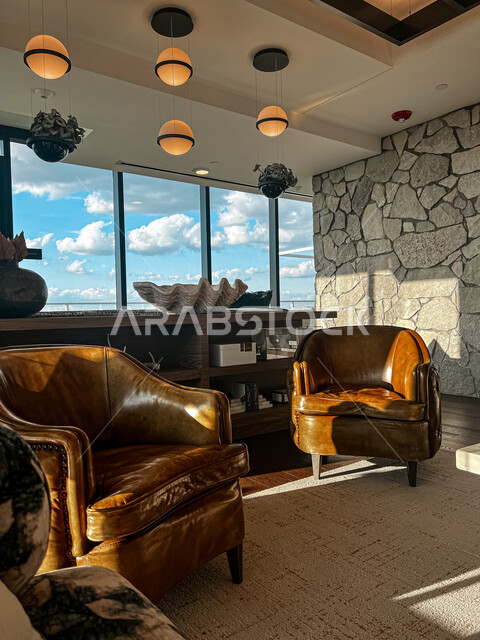 غرفة معيشة بتصاميم فاخرة، ديكورات رائعة، أثاث منزلي، تصاميم عصرية، كنب بني، شقق سكنية، ديكور داخلي