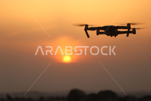Drone flying in the sky at sunset, drone, aerial photography