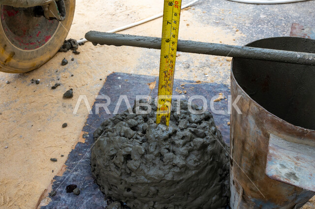 Close-up of cement mixed with gravel, cement preparation and processing, cement filling containers, construction work, cement mixing
