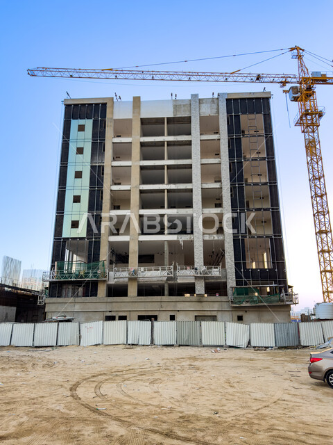 Building under construction, architecture, urban development, residential projects, apartments, offices, tower crane.