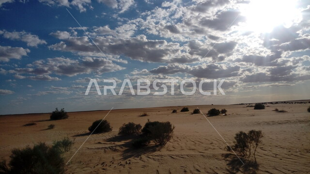 . Landscape of the desert and the sun covered by clouds, nature in the Kingdom, natural backgrounds