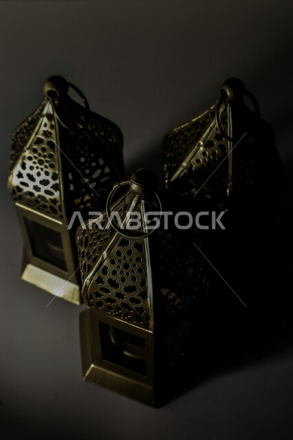 .Traditional metal Arab lanterns, lighting and decorations for the month of Ramadan, Ramadan antiques, celebrating the advent of the month of Ramadan, decorations and decorations, a Ramadan atmosphere, a black background