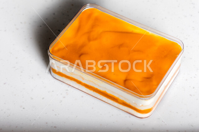 .Delicious mango cake, cake with layers of cream and fresh mango, sweets and sugars, dessert molds with natural fruits, white background