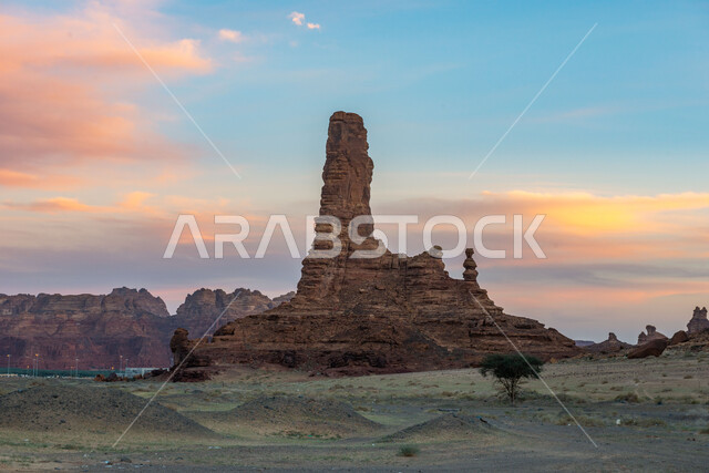 Rock formations in Al-Ula Governorate in the Kingdom of Saudi Arabia, sandy hills, green trees, ancient historical monuments, rocky peaks and heights, desert nature, tourist places