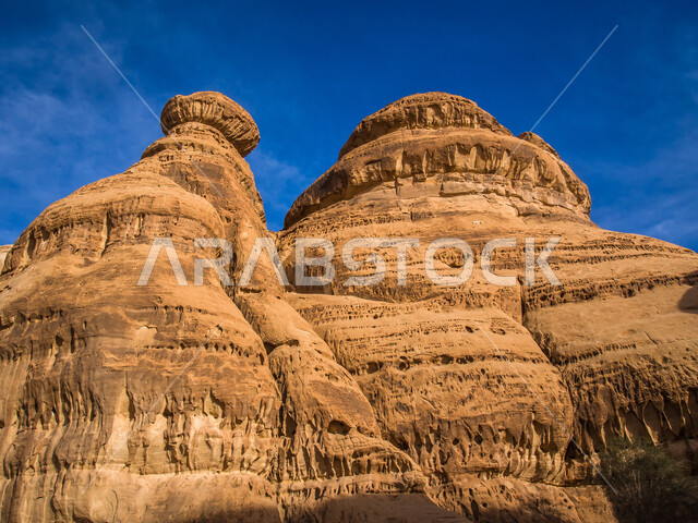 Rock formations in Al-Ula Governorate in the Kingdom of Saudi Arabia, ancient historical monuments, mountain peaks and heights, desert nature, tourism in Saudi Arabia