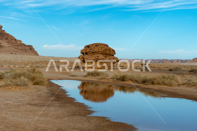 Natural rock formations, rain water, ancient historical monuments in Al-Ula Governorate, Saudi Arabia, rocky peaks and heights, desert nature, tourist places