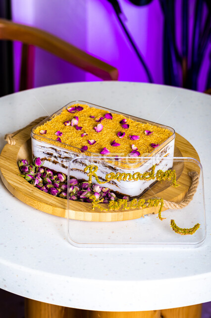 .A dish of Ramadan baklava cake decorated with flowers, oriental sweets, Ramadan sweets, sweets and sugars, delicious candy pieces, dessert, white background