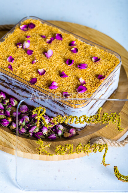 .A dish of Ramadan baklava cake decorated with flowers, oriental sweets, Ramadan sweets, sweets and sugars, delicious candy pieces, dessert, white background