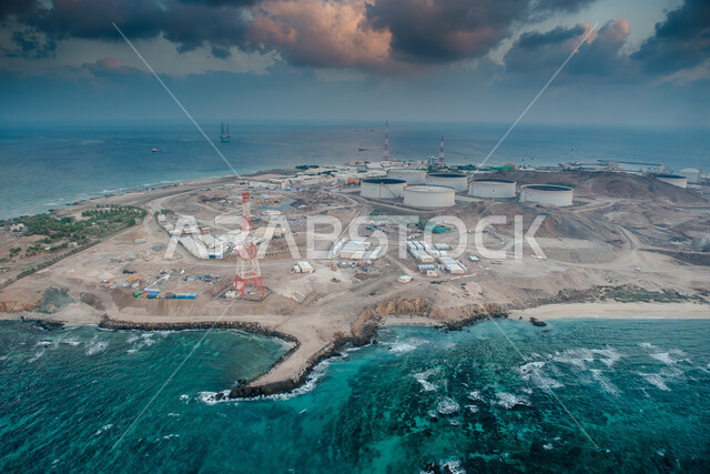 A picture from an upper angle of Halul Island in the State of Qatar, cloudy sky, oil storage area, oil loading station, offshore fields, island in the middle of the sea, Qatar landmarks