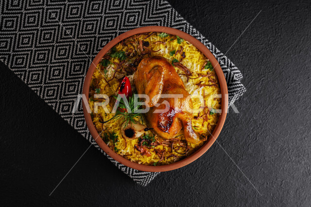 A dish of Kabsa rice with chicken and vegetables, traditional Gulf Arab meals, popular dishes, oriental restaurants for Saudi cuisine recipes, a gray background